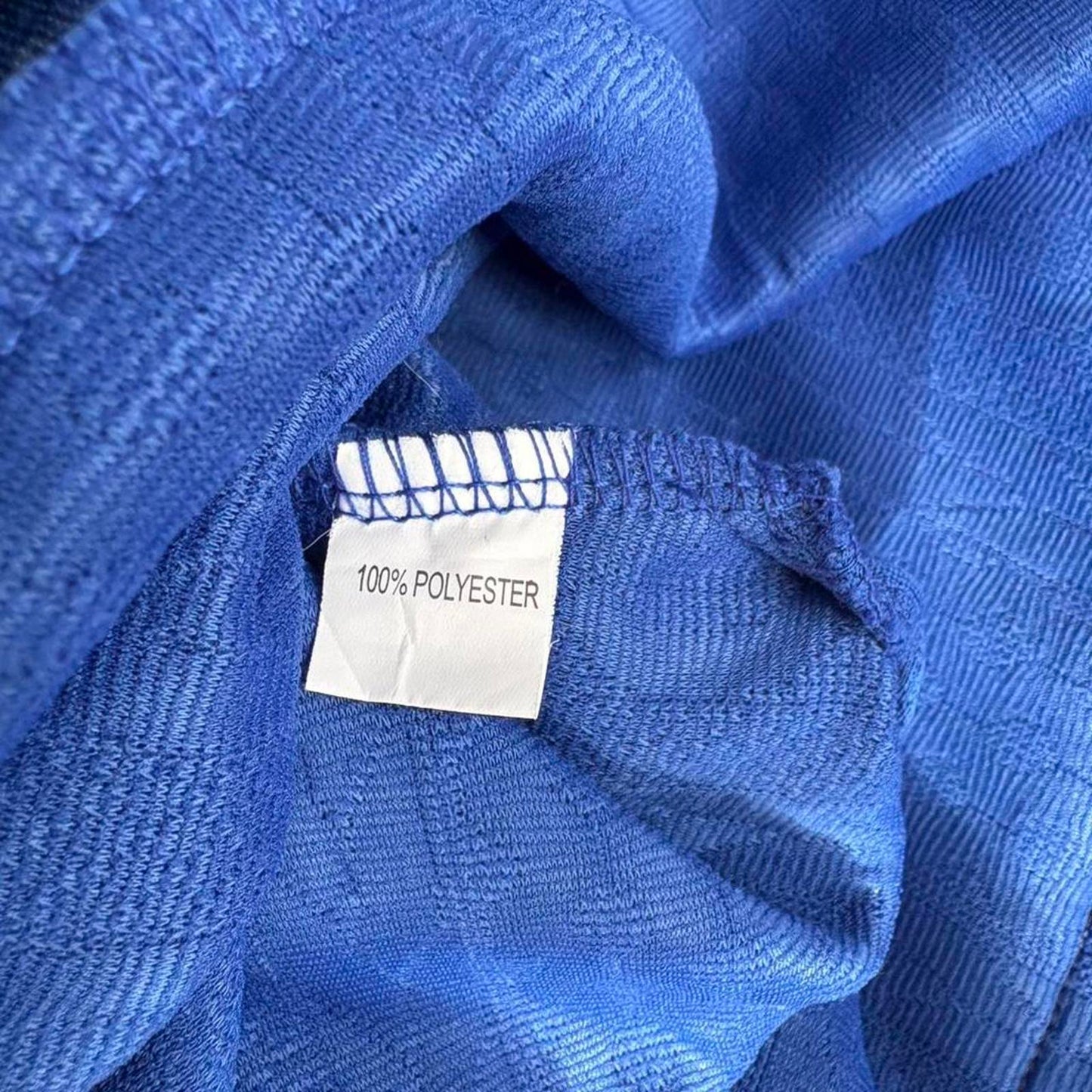 Textured knit pullover sweatshirt in a vibrant cobalt blue.