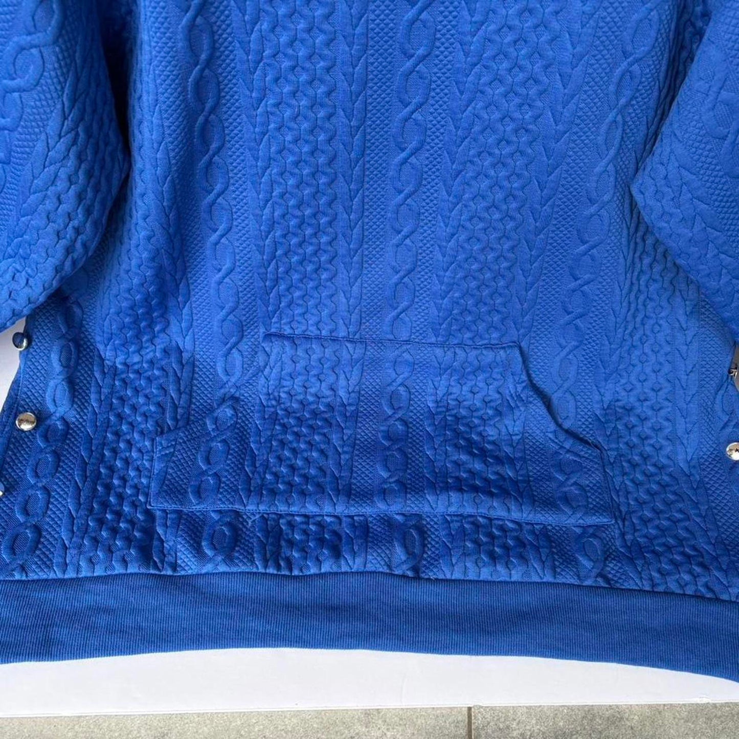 Textured knit pullover sweatshirt in a vibrant cobalt blue.