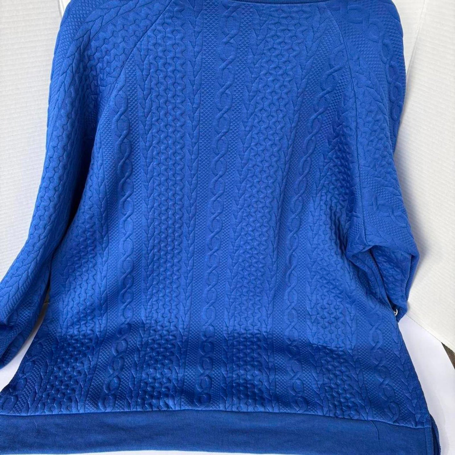 Textured knit pullover sweatshirt in a vibrant cobalt blue.